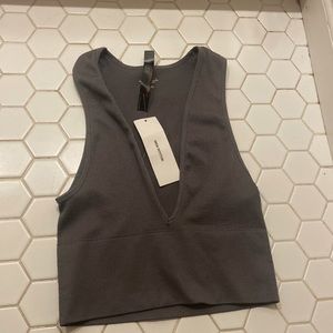 Urban Outfitters out from under tank top